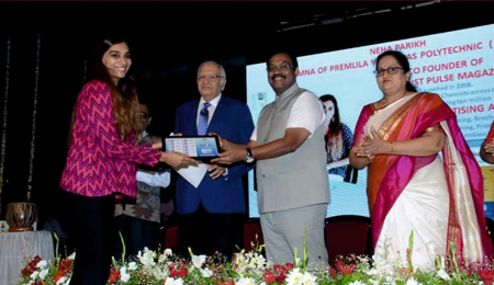 Neha receiving award